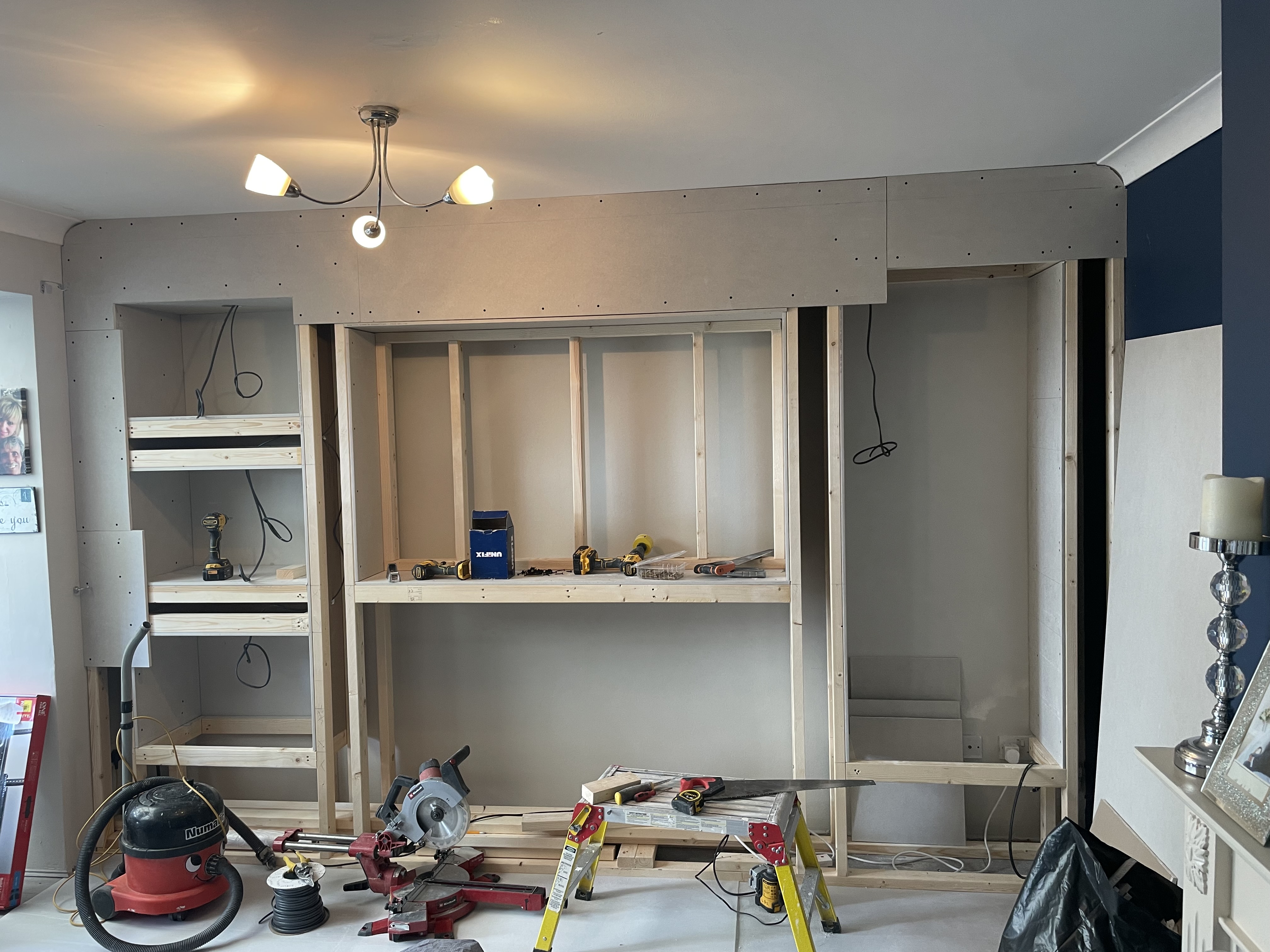 Plain living room wall before bespoke media wall installation