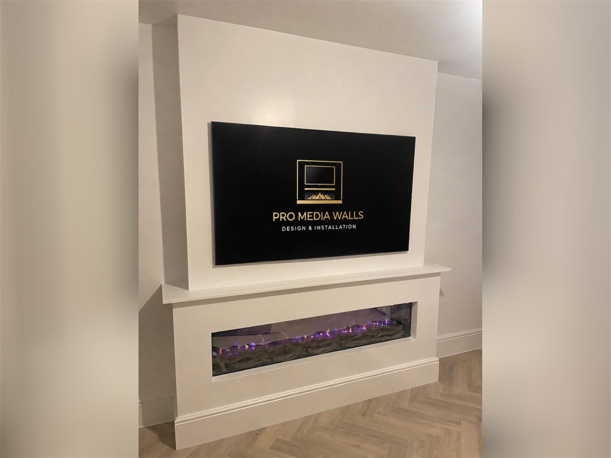 Contemporary media wall with fireplace surround and soft neutral finish