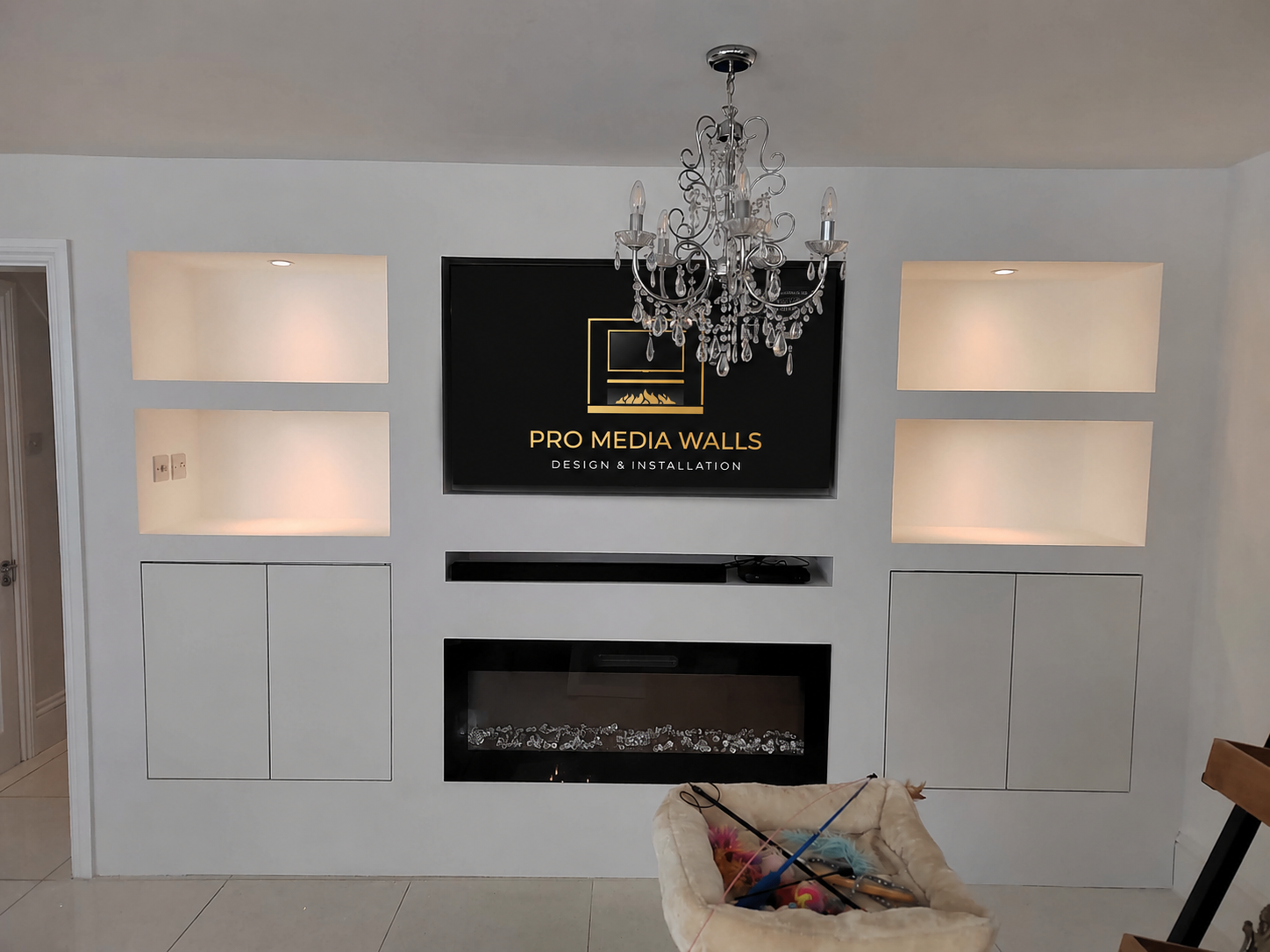 Luxury media wall with textured finish and bronze accent details